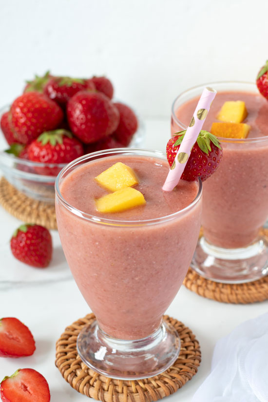 strawberry peach smoothie with fruit garnish